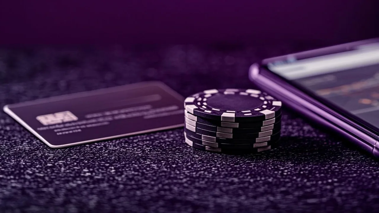 Phone screen showing a deposit confirmation, purple neon payment icons on a dark graphite surface